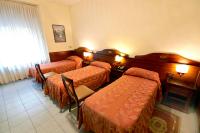 Posteľ alebo postele v izbe v ubytovaní Hotel Pavone