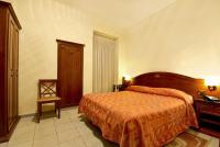 Posteľ alebo postele v izbe v ubytovaní Hotel Pavone