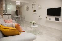 Televízia a/alebo spoločenská miestnosť v ubytovaní Málaga Peña Historical Centre Apartment