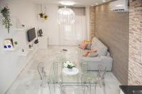 Televízia a/alebo spoločenská miestnosť v ubytovaní Málaga Peña Historical Centre Apartment