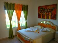 Postel nebo postele na pokoji v ubytování El Malecon B&B Hotel