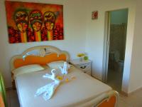 Postel nebo postele na pokoji v ubytování El Malecon B&B Hotel