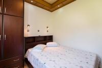 Posteľ alebo postele v izbe v ubytovaní Semiramis Cottage
