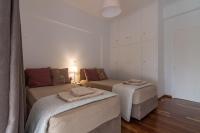 Posteľ alebo postele v izbe v ubytovaní Athenian Apartment