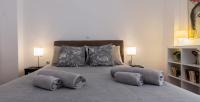 Posteľ alebo postele v izbe v ubytovaní Athenian Apartment