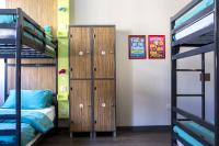 a dorm room with bunk beds and a locker at Kick Ass Greyfriars (18+) in Edinburgh