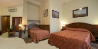 Posteľ alebo postele v izbe v ubytovaní Hotel Pavone
