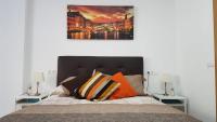 A bed or beds in a room at Apartamento Silvia