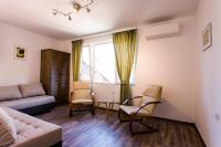 Posezení v ubytování Top center big family apartment with garden view