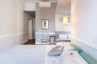 A bed or beds in a room at Guest House Poerio88