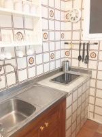 A kitchen or kitchenette at Apartamentos Albertos