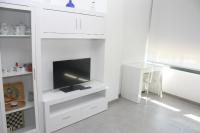 TV a/nebo společenská místnost v ubytování Piso Capri 2 Inmomart
