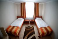Łóżko lub łóżka w pokoju w obiekcie Borka Apartman