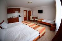 Łóżko lub łóżka w pokoju w obiekcie Borka Apartman