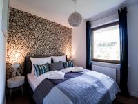 Łóżko lub łóżka w pokoju w obiekcie Apartamenty Bawaria