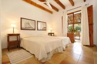 A bed or beds in a room at Teulada