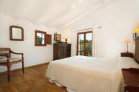 A bed or beds in a room at Teulada