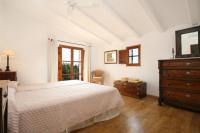 A bed or beds in a room at Teulada