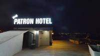 a sign for a tarron hotel on top of a building at Patron Hotel in Antalya