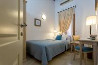 a hotel room with a bed and a table and a desk at Alla Vite Dorata in Venice