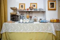 a table with a yellow and white table cloth at Alla Vite Dorata in Venice