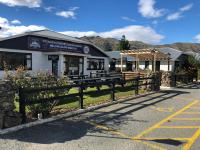 a building with a fence in front of it at Otematata Escapes in Otematata
