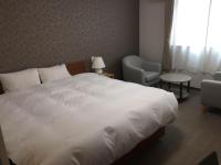 SUN PLAZA HOTEL 富士山中湖にあるベッド