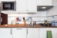 Kuchyň nebo kuchyňský kout v ubytování Przytulny Apartament przy Teatrze Wielkim