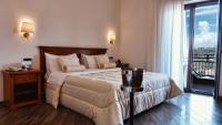 Postel nebo postele na pokoji v ubytování Resort Santangelo & SPA