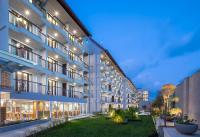an exterior view of a building at night at Eastin Ashta Resort Canggu in Canggu