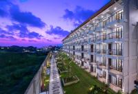 an exterior view of a building at dusk at Eastin Ashta Resort Canggu in Canggu