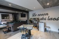 a kitchen with a table and a sign that says do ocean uses taxes at Le cocon des lacs in Boussu-lez-Walcourt