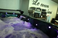 a jacuzzi tub with a waterfall in a room at Le cocon des lacs in Boussu-lez-Walcourt