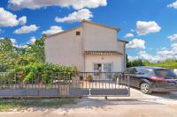 a car parked in front of a house at Apartment Mirella 1745 in Bale