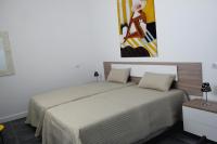 A bed or beds in a room at Villa Royale Trespalomas