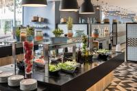 a buffet line with plates and bowls of food at Falkensteiner Club Funimation Borik in Zadar