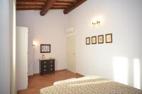 A bed or beds in a room at Agriturismo La Fonte
