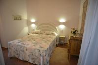 A bed or beds in a room at Agriturismo La Fonte
