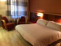 Postel nebo postele na pokoji v ubytování Hostal de la Gloria