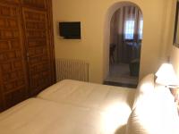 Postel nebo postele na pokoji v ubytování Hostal de la Gloria