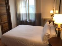 Postel nebo postele na pokoji v ubytování Hostal de la Gloria
