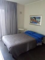 A bed or beds in a room at Uniclub House