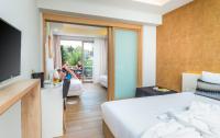 Poseidon Hotel Sea Resortにあるベッド