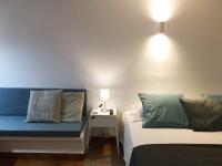 A bed or beds in a room at Apartamentos Albertos