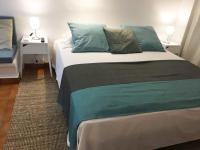 A bed or beds in a room at Apartamentos Albertos