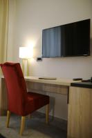 Televízia a/alebo spoločenská miestnosť v ubytovaní Teatro Verdi Boutique Hotel
