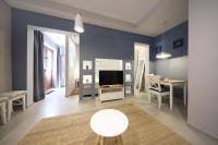 Televízia a/alebo spoločenská miestnosť v ubytovaní Teatro Verdi Accommodation