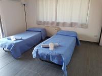 A bed or beds in a room at Lilium In B&B