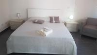 A bed or beds in a room at Lilium In B&B