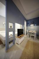 Televízia a/alebo spoločenská miestnosť v ubytovaní Teatro Verdi Accommodation